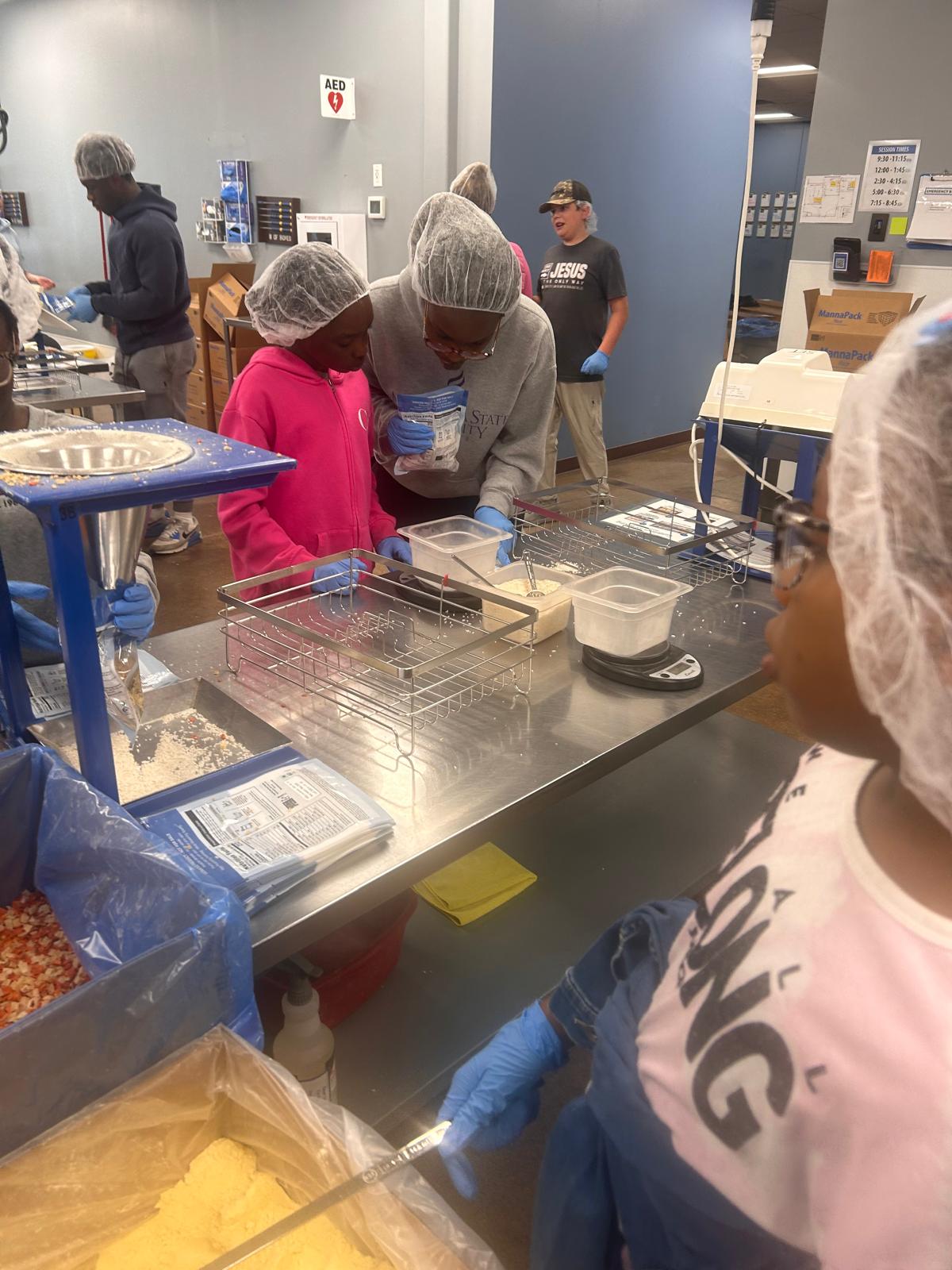Volunteers preparing meals for those in need